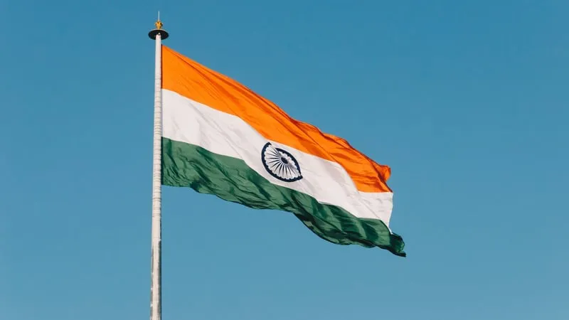 India rupee and USDT stablecoin representing the USDT premium spike following enforcement raids in Bengaluru