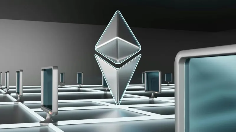 A silver Ethereum logo floating above a grid of screens